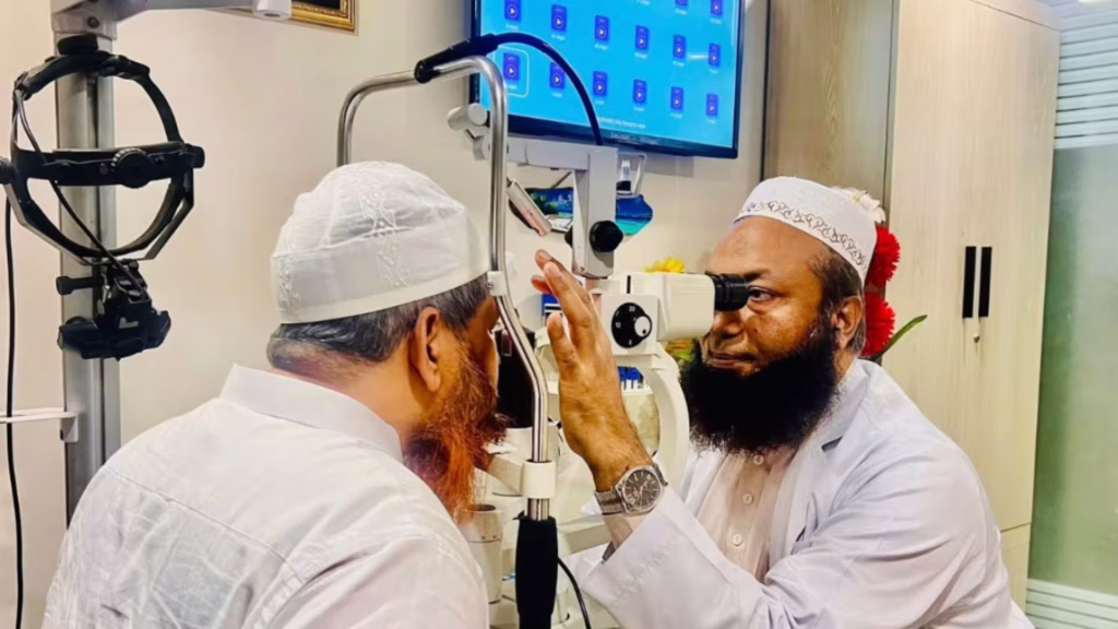 Doctor administering Vitamin A in Bangladesh's nationwide Vitamin A supplement campaign. Need alt text, caption, and description